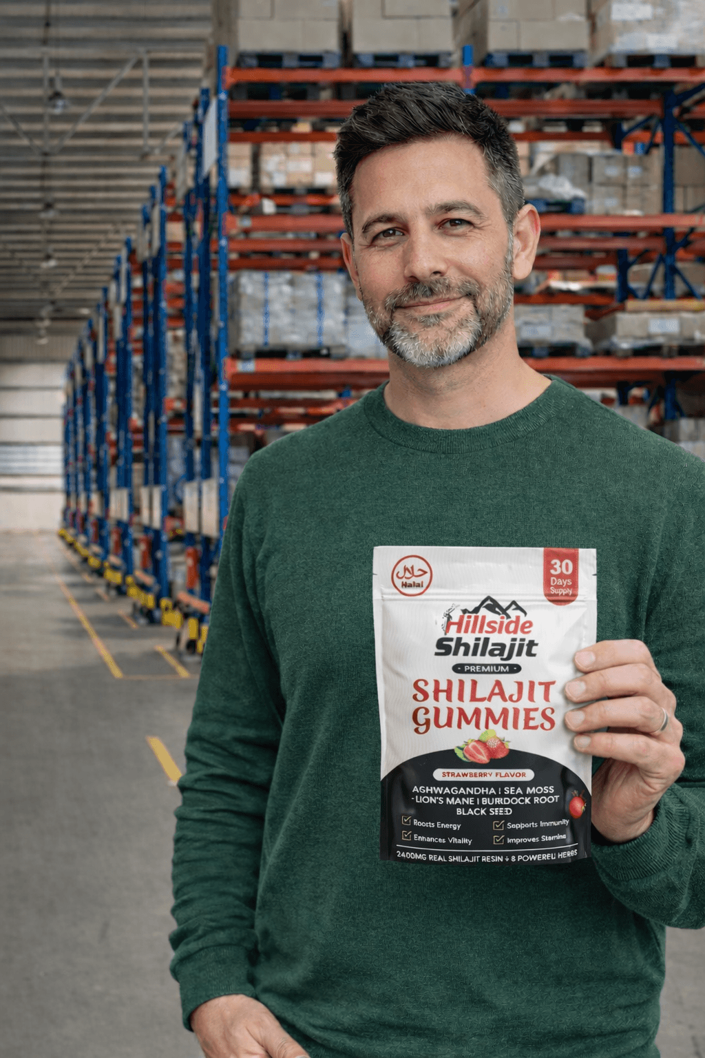 Customer holding Hillside Shilajit gummies in a fulfilment warehouse